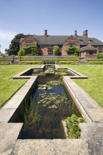 Formal pond at Goddards Garden in June in York, North Yorkshire. Image reference 304889. ©National Trust Images/Mark Sunderland. www.nationaltrust.org.uk