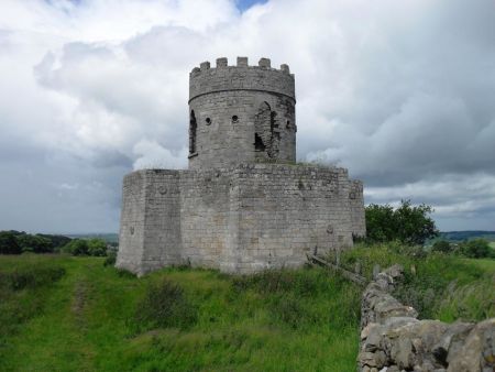 Folly building in foreground with distant landscape beyond