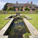 Formal pond at Goddards Garden in June in York, North Yorkshire. Image reference 304889. ©National Trust Images/Mark Sunderland. www.nationaltrust.org.uk