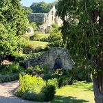 Jervaulx Hall gardens with Abbey in background